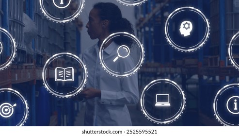 Image of icons and digital data processing over biracial woman working in warehouse. Global shipping, connections, computing and data processing concept digitally generated image.
