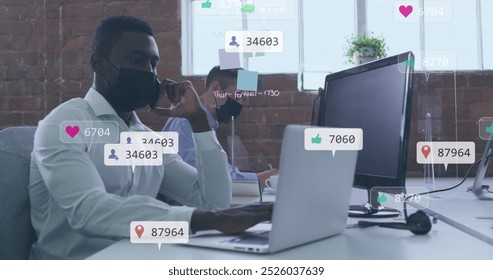 Image of icons and numbers over african american man in face mask using smartphone. Global social media, business, cloud computing and data processing concept digitally generated image. - Powered by Shutterstock - Get 15% off with code: PIKWIZARD15