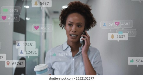 Image of icons and numbers over african american businesswoman using smartphone. Global networking, business, connections, computing and data processing concept digitally generated image. - Powered by Shutterstock