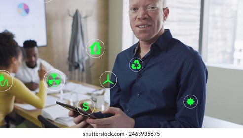 Image of icons over albino african american businessman using tablet at office. Global business, communication and digital interface concept digitally generated image. - Powered by Shutterstock