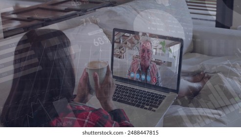 Image of infographic interface over caucasian woman image calling with senior man on laptop. Digital composite, family, love, talking, technology, graphs, report, business, coffee cup. - Powered by Shutterstock