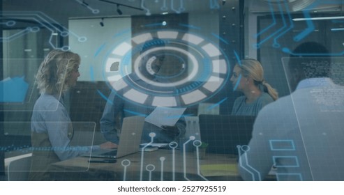 Image of interface with data processing over diverse colleagues discussing together at office. Computer interface and business technology concept - Powered by Shutterstock