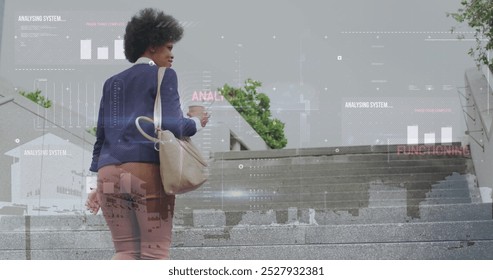 Image of interface with data processing over african american businesswoman climbing stairs. Computer interface and business technology concept - Powered by Shutterstock