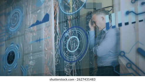 Image of interface with data processing over caucasian male engineer working at server room. Computer interface and business data storage technology concept