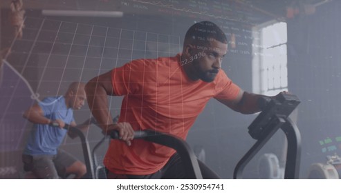 Image of interface processing data over african american man cross training on elliptical at gym. Fitness, exercise, strength, data, digital interface and technology digitally generated image. - Powered by Shutterstock