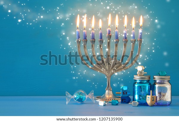 image of jewish holiday Hanukkah\
background with menorah (traditional candelabra) and\
candles