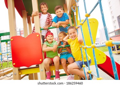 Image of joyful friends having fun on playground outdoors  - Shutterstock ID 186259460