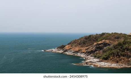 Image of a landscape in Phuket, Thailand near Promthep Cape, a beautiful seaside rock formation and blue waters. - Powered by Shutterstock