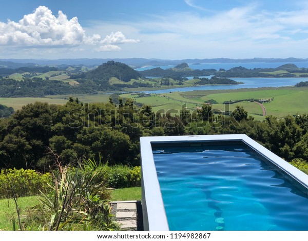 Image of lap\
pool in New Zealand with magical\
view