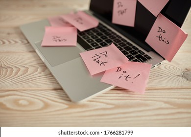 Image of laptop full of sticky notes reminders on screen. Work overload concept image. Coworking or working at home concept image.