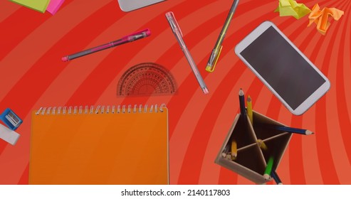 Image Of Laptop And Office Items Over Orange Spinning Stripes. Business, Office And Tidy Work Space Concept Digitally Generated Image.