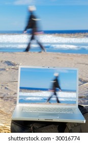 Image Of Laptop On A Beach And Goin Men On A Background