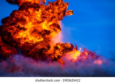 Image of large explosion fireball with flames and smoke.