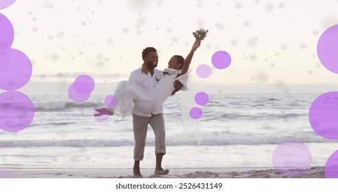 Image of light spots over african american couple getting married on beach. Wedding day, celebration, togetherness and love concept digitally generated image. - Powered by Shutterstock