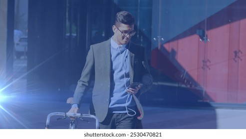 Image of light spots over biracial businessman using smartphone. national bike to work day and celebration concept digitally generated image. - Powered by Shutterstock