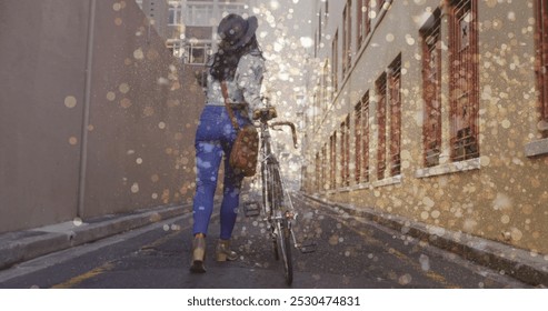 Image of light spots over biracial woman walking with bicycle. national bike to work day and celebration concept digitally generated image. - Powered by Shutterstock