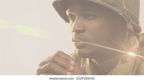 Image of light trails over african american male soldier. Politics and patriotism concept digitally generated image. - Powered by Shutterstock