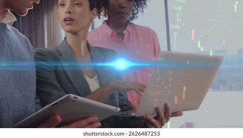 Image of lights and graphs over midsection of diverse businesspeople working in office. business, finance, economy and working in office with technology concept digitally generated image.