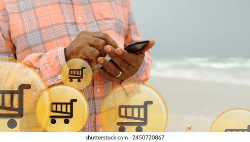 Image of like over midsection of biracial woman using smartphone at beach. global connections, online shopping, technology and digital interface concept digitally generated image. - Powered by Shutterstock