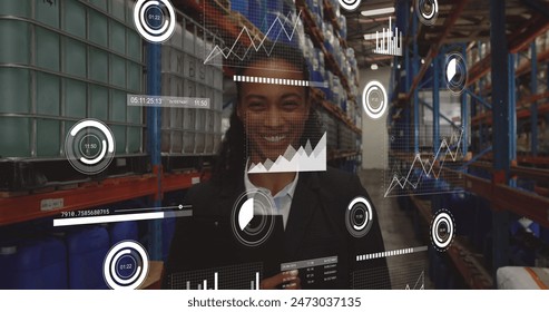 Image of loading bars and graphs over smiling biracial female manager in factory. Digital composite, multiple exposure, report, progress, shelf, auto repair shop, manufacturing. - Powered by Shutterstock