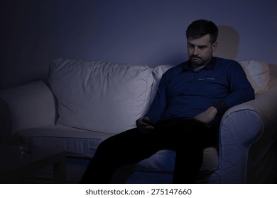 Image of lonely man spending evening alone