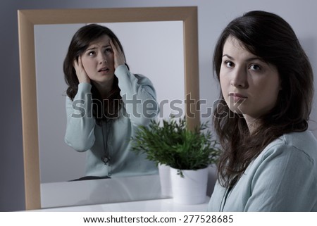 Image of lonely woman suffering from schizophrenia