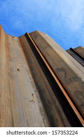 Image Looking Up Some Earth Supporting Sheet Piles From Down In An Excavation On A Construction Site