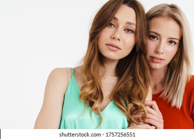 Image Of Lovely Caucasian Two Women Hugging And Looking At Camera Isolated Over White Background