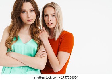 Image Of Lovely Thinking Two Women Hugging And Looking At Camera Isolated Over White Background