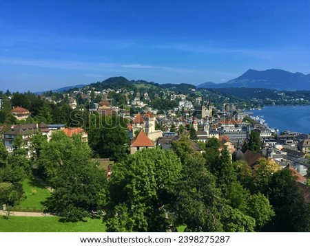 An image of Lucerne, a city in Switzerland known for its beauty and history. There are many buildings built in the Middle Ages. The beautiful River Royce.