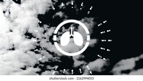 Image Of Lungs Icon Over Clouds On Black Background. National Clean Air Day And Celebration Concept Digitally Generated Image.