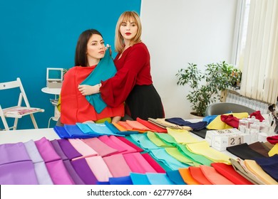 Image Maker Determines The Colors That Best Suit An Individual Based On Client. Stylist Holding Shawls