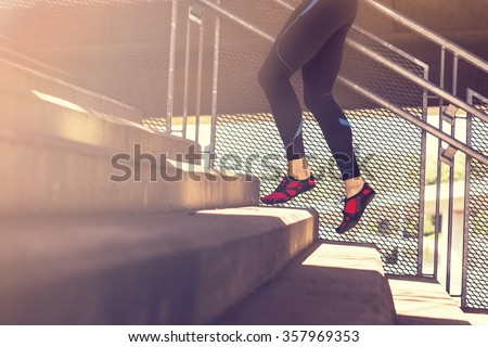 Image of male legs running up the stairs, working out.