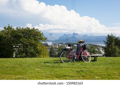 An image of a man with a bicycle