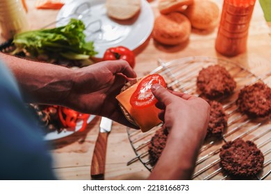 Image Of A Man Cooking Burger