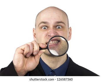 Image Of A Man With Magnifier Magnified His Grinding Teeth On A White Background