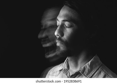 Image of a man meditating with his eyes closed leaving a blurred image, screaming euphoric, uncontrolled. Long exposure photography. Concept of mental effects of pandemic. Copy space