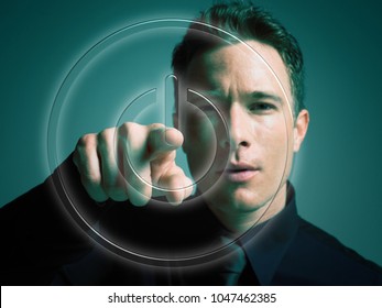 An image of a man touching power button