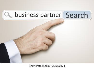 An image of a man who is searching the web for business partner - Shutterstock ID 253392874