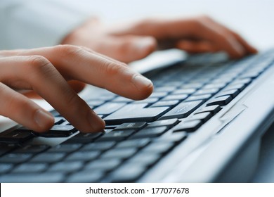 Image of man's hands typing. Selective focus - Shutterstock ID 177077678