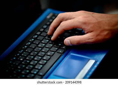 Image of man's hands typing. Selective focus - Shutterstock ID 209144398