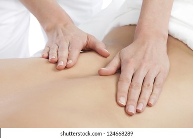 Image of a Masseuse giving a relaxing back massage at a spa - Powered by Shutterstock