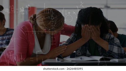 Image of math formulas moving over caucasian female teacher supporting crying girl at school. learning, school, education and technology concept digitally generated image.
