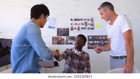 Image of mathematical equations and financial data processing over diverse colleagues. Global business, finances, computing and digital interface concept digitally generated image.