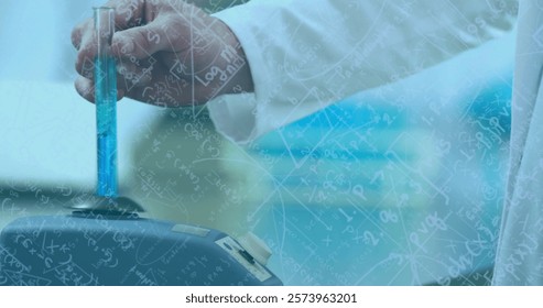 Image of mathematical equations over caucasian male scientist working in lab. Science, medicine, equations and digital interface concept digitally generated image.