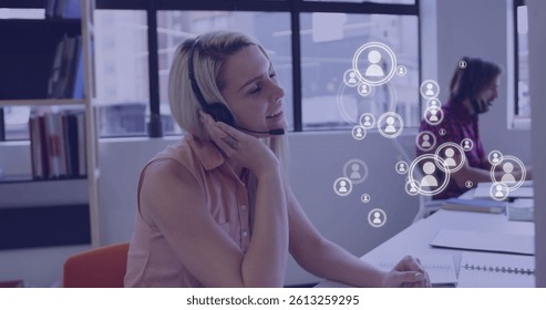 Image of media icons over caucasian business people using phone headsets. global networks, business, data processing and digital interface concept digitally generated image.