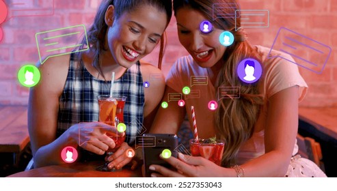 Image of media icons over happy caucasian female friends with drinks. world cocktail day and celebration concept digitally generated image. - Powered by Shutterstock