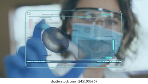Image of medical data processing on screen over female scientist holding test tube. global coronavirus pandemic, medicine and healthcare concept digitally generated image.