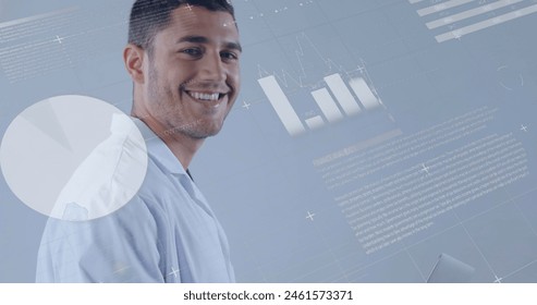 Image of medical data processing over attractive male medical worker wearing white suit using laptop and smiling. Global medicine healthcare concept digital composite.