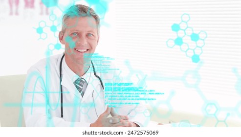 Image of medical data processing over smiling caucasian male doctor at desk. Medical and healthcare services, hospital, digital interface and technology, digitally generated image.